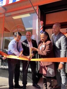 ribbon cutting the shop