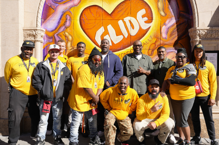 Killer Mike outside with GLIDE's Safety Team